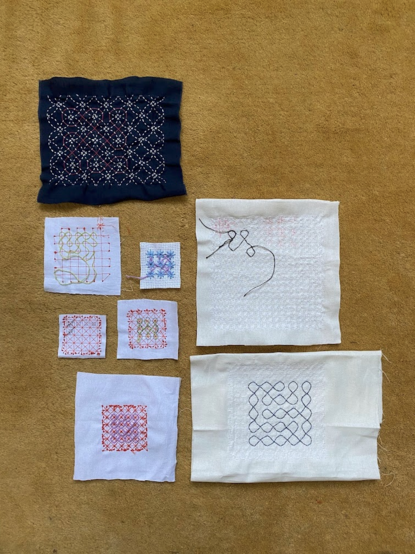 Some experiments in hand-whipping kolam stitches around machine embroidery